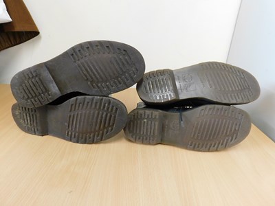 Lot 146 - Two pairs of Dr Martens boots: a pair of black...