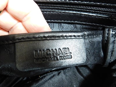 Lot 135 - A Michael Kors black quilted leather handbag...