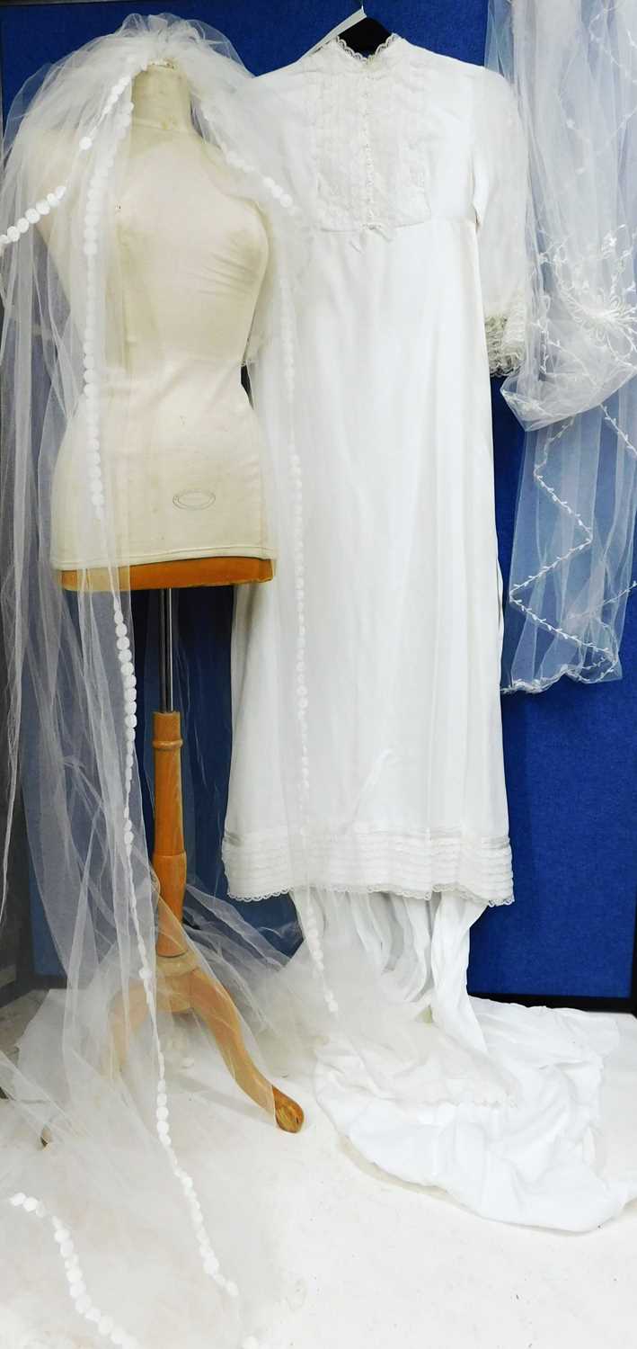 Lot 89 - A circa 1960's/70's wedding dress with lace...