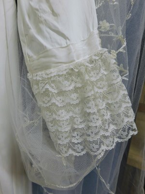 Lot 89 - A circa 1960's/70's wedding dress with lace...