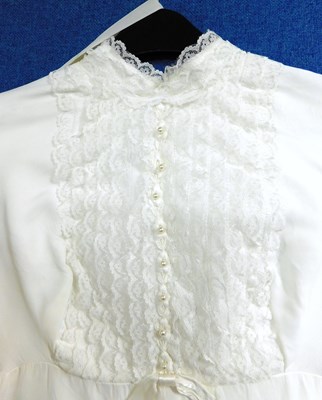 Lot 89 - A circa 1960's/70's wedding dress with lace...