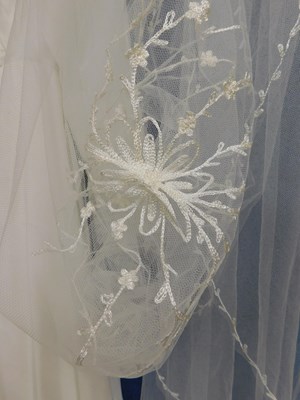 Lot 89 - A circa 1960's/70's wedding dress with lace...