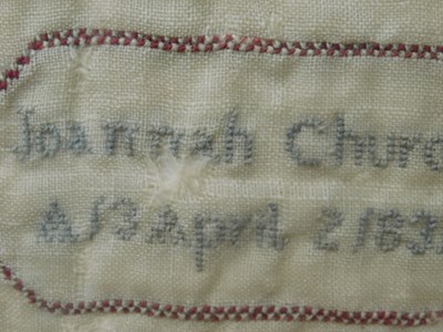 Lot 184 - An early Victorian sampler, with floral motifs...