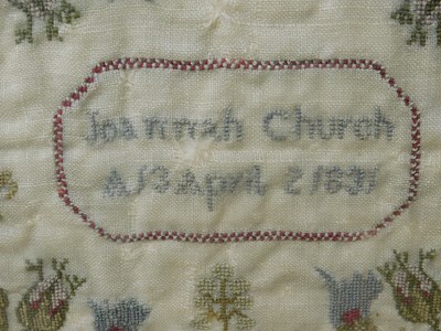Lot 184 - An early Victorian sampler, with floral motifs...