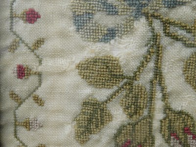 Lot 184 - An early Victorian sampler, with floral motifs...