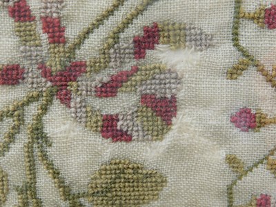 Lot 184 - An early Victorian sampler, with floral motifs...
