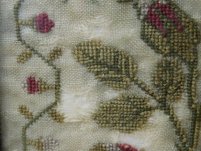 Lot 184 - An early Victorian sampler, with floral motifs...