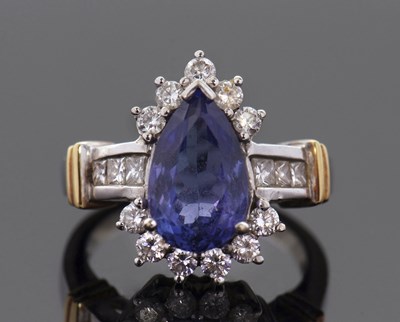 Lot 290 - A tanzanite and diamond ring, the pear shape...