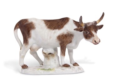 Lot 345 - A Meissen model of a cow on shaped oval base,...