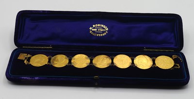 Lot 54 - Bracelet comprising of seven GRIII Gold...