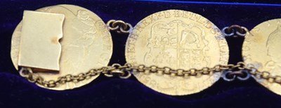 Lot 54 - Bracelet comprising of seven GRIII Gold...