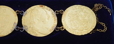 Lot 54 - Bracelet comprising of seven GRIII Gold...