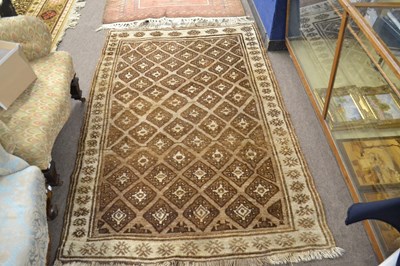 Lot 623 - A small Middle Eastern wool floor rug with...
