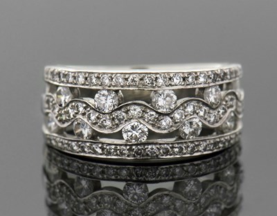 Lot 299 - An 18ct diamond ring, the tapered band set...