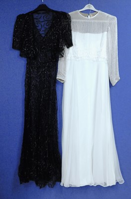 Lot 10 - A lady's black net and ribboned style V neck...