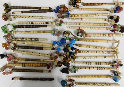 Lot 139 - A quantity of lace bobbins, to include bone...