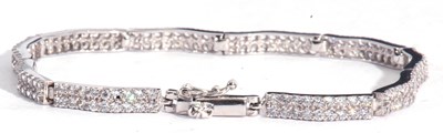 Lot 202 - Modern articulated line bracelet set with...