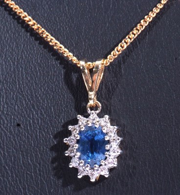 Lot 203 - Modern sapphire and diamond pendant stamped...