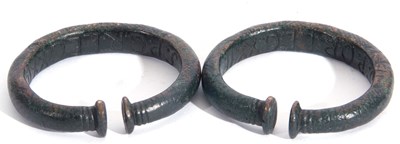Lot 243 - Pair of bronzed metal torc bracelets with...