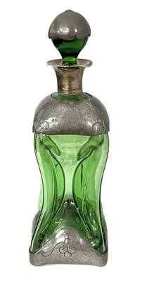 Lot 302 - An Art Nouveau green glass decanter with...