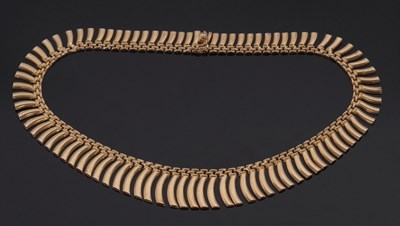 Lot 310 - A gold fringe necklace, the graduated curved...