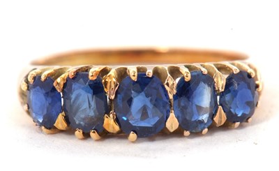 Lot 7 - An early 20th century sapphire ring, the five...