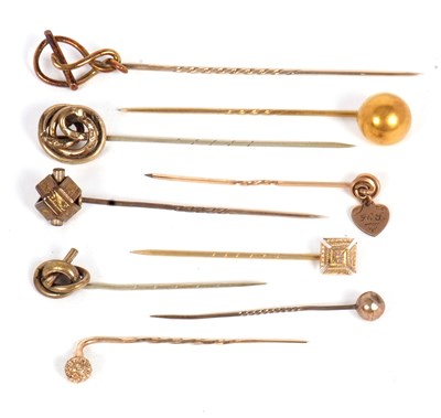 Lot 190 - Nine assorted unmarked yellow metal stick pins,...