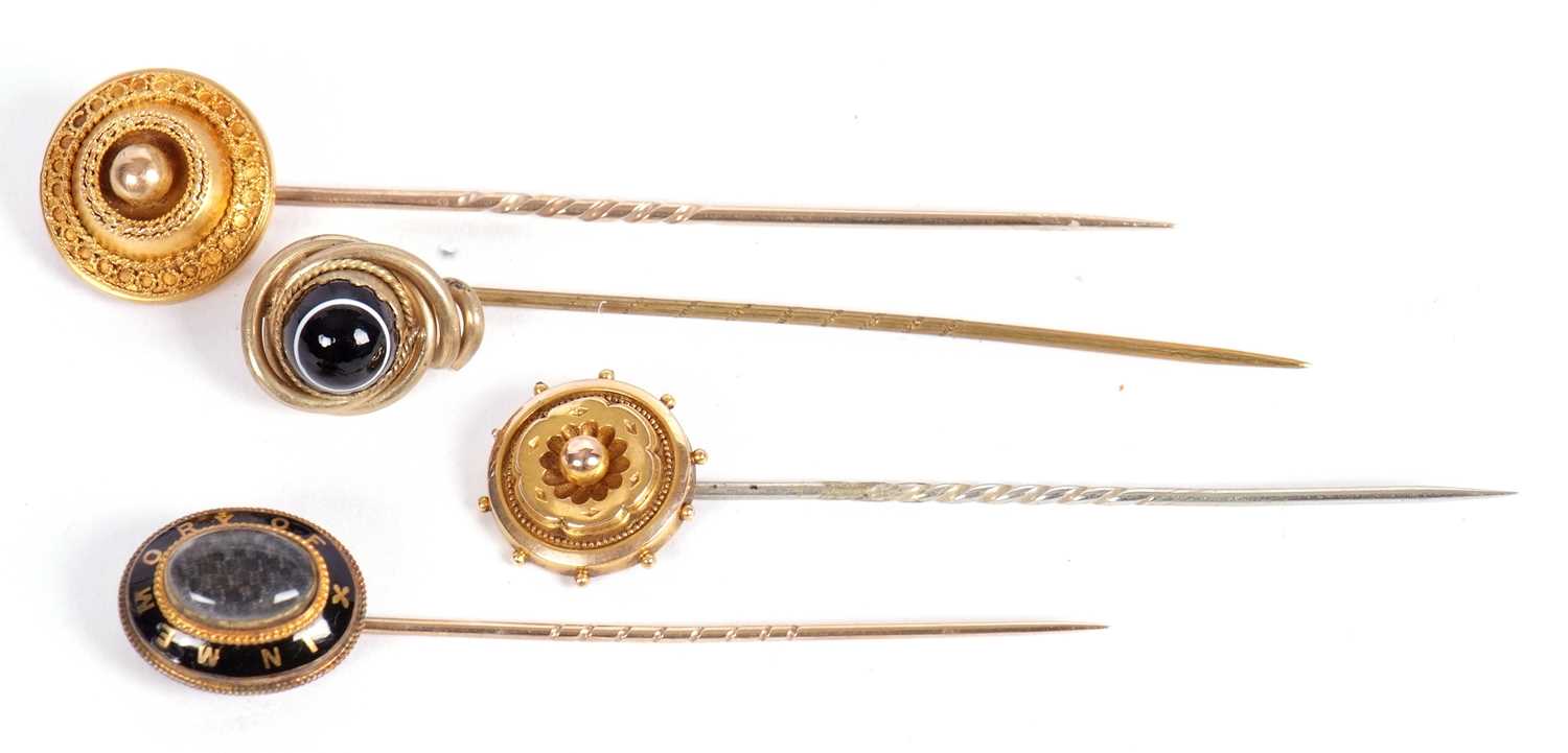 Lot 62 - Four stick pins: to include a 19th century...