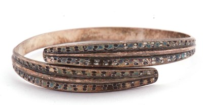 Lot 205 - A David Andersen wraparound silver bangle, the...