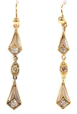 Lot 99 - A pair of diamond earrings, set with three old...