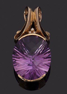 Lot 294 - An amethyst and diamond pendant, the oval...