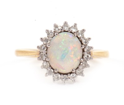 Lot 1 - An 18ct opal and diamond ring, the oval opal...