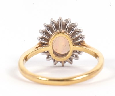 Lot 1 - An 18ct opal and diamond ring, the oval opal...