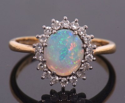 Lot 1 - An 18ct opal and diamond ring, the oval opal...