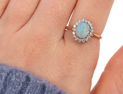 Lot 1 - An 18ct opal and diamond ring, the oval opal...