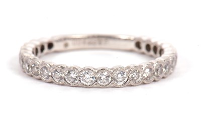 Lot 2 - A platinum diamond ring, the band three...