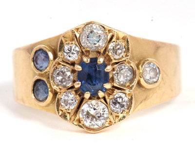 Lot 40 - A sapphire and diamond ring, set to centre...