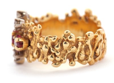 Lot 12 - A mid 20th century 18ct ruby and diamond ring,...