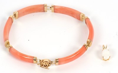 Lot 110 - A coral bracelet and an opal pendant, the...