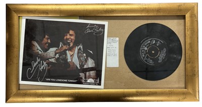 Lot 108 - ELVIS PRESLEY. Stage shot of Elvis Presley...