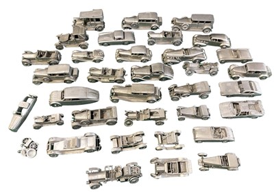 Lot 110 - A collection of pewter cars by the Danbury Mint