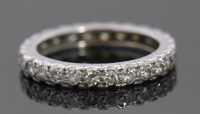 Lot 298 - A diamond eternity ring, set with single cut...