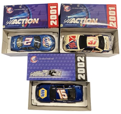 Lot 86 - Three boxed 1: 24 NASCAR model cars by Action...