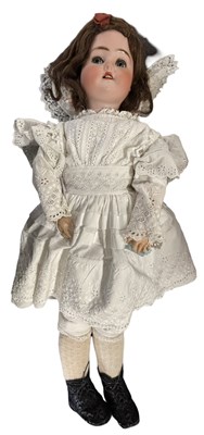 Lot 243 - A bisque head Adolf Wislizenus doll in white...