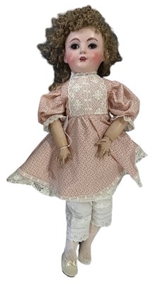 Lot 246 - A large SFBJ girl doll with sleep eyes, open...