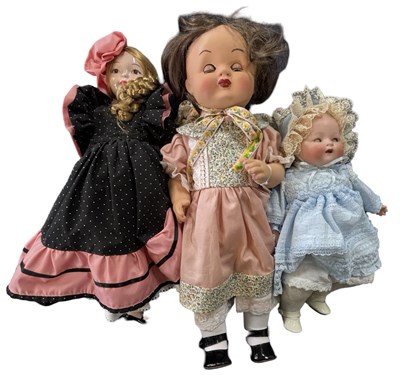 Lot 224 - A trio of various porcelain dolls, various sizes