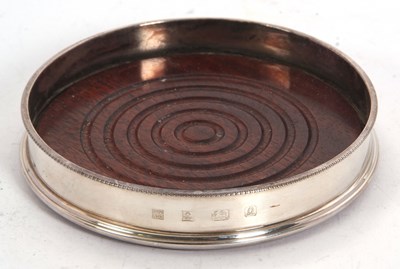 Lot 166 - An Elizabeth II silver framed coaster having a...