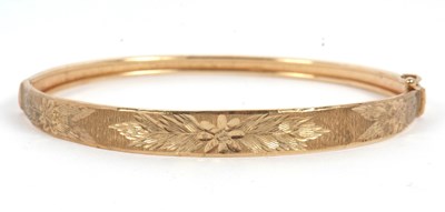 Lot 146 - A 9ct gold bangle, the hinged bangle with...