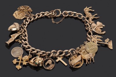 Lot 312 - A 9ct charm bracelet: the curblink bracelet...