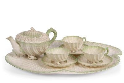 Lot 31 - A Belleek china tea set with moulded design of...